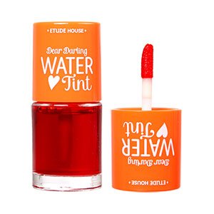 ETUDE Dear Darling Water Tint 9.5g #03 Orange Ade — slim tube with orange cap and clear body showing the liquid tint level.
