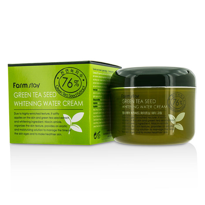 Farmstay Green Tea Seed Brightening Cream 100g in a white jar with green accents, shown on a clean surface