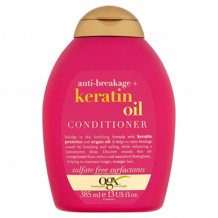 OGX Anti-Breakage Keratin Oil Conditioner 385ml bottle on white background