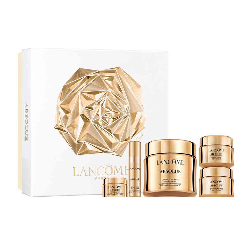 Lancôme Absolue holiday skincare set in a gold and white box with five deluxe products lined up