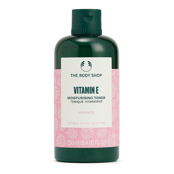 The Body Shop Vitamin E Moisturising Toner in a 250 ml clear bottle with white cap, placed on a marble surface