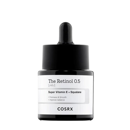 COSRX The Retinol 0.5 Oil in a 20ml glass dropper bottle on a white marble surface
