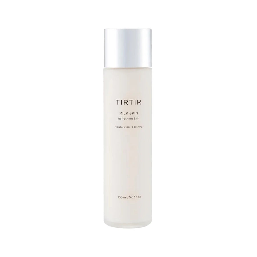 TIRTIR Milk Skin Toner in a white bottle with a silver cap, standing on a marble surface