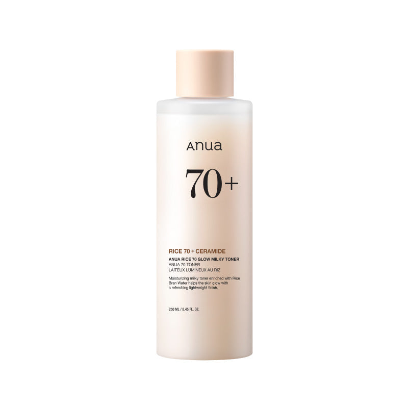 Anua Rice 70 Glow Milky Toner in a white bottle with pump, standing on a marble surface