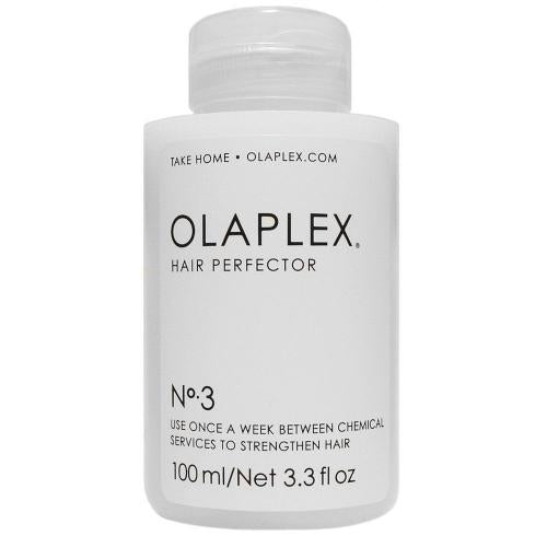 Olaplex No.3 Hair Perfector 100ml white bottle on marble surface