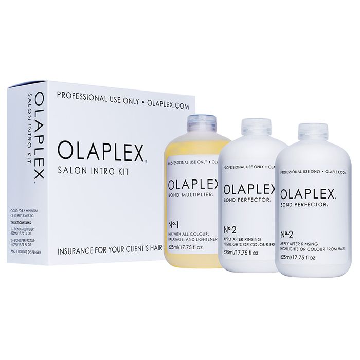 Olaplex Salon Kit 3x525ml bottles arranged on a marble counter, professional bond repair haircare
