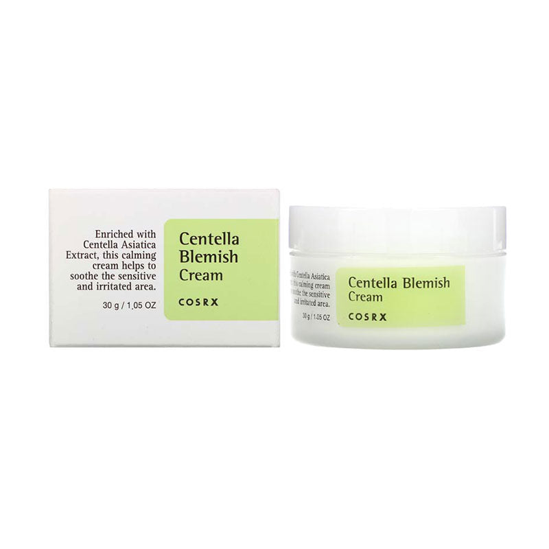 Cosrx Centella Blemish Cream 30G tube on marble surface with dropper and green leaves