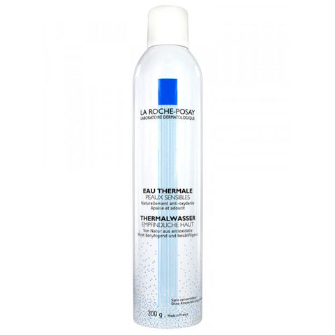Close-up of La Roche-Posay thermal mist spraying fine droplets onto skin