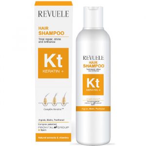 Revuele Kt Keratin + Hair Shampoo in a 200ml white bottle with blue and green accents, held against a neutral background