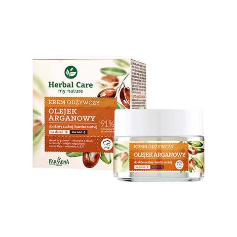 Farmona Herbal Care face cream jar with orange lid and herbal leaf design on label, front view